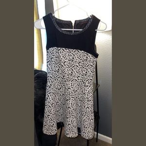 Zip up black dress with pattern. Flowy.